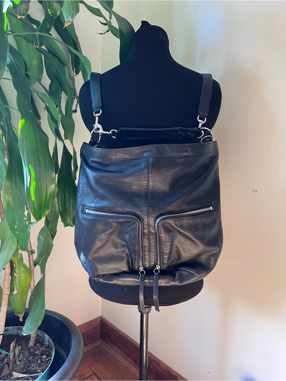All Saints Black Leather Zip-Front Backpack with detailed leather wrist strap!